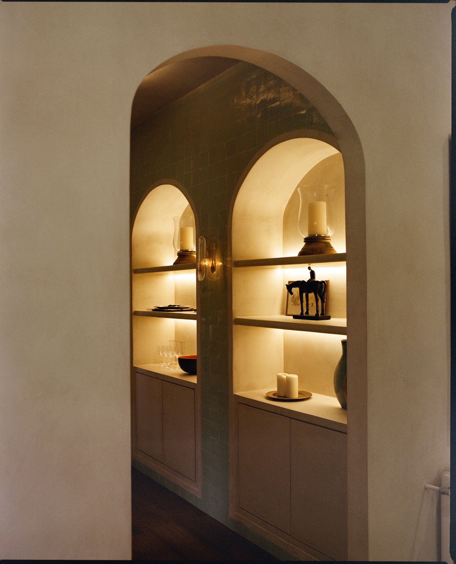 Arched display niches with ceramics and timber