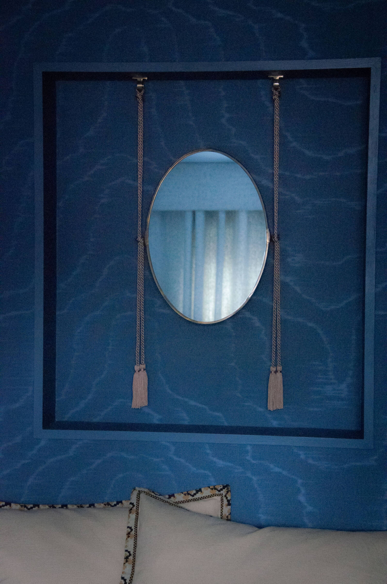 Blue lacquered niche with inset oval mirror