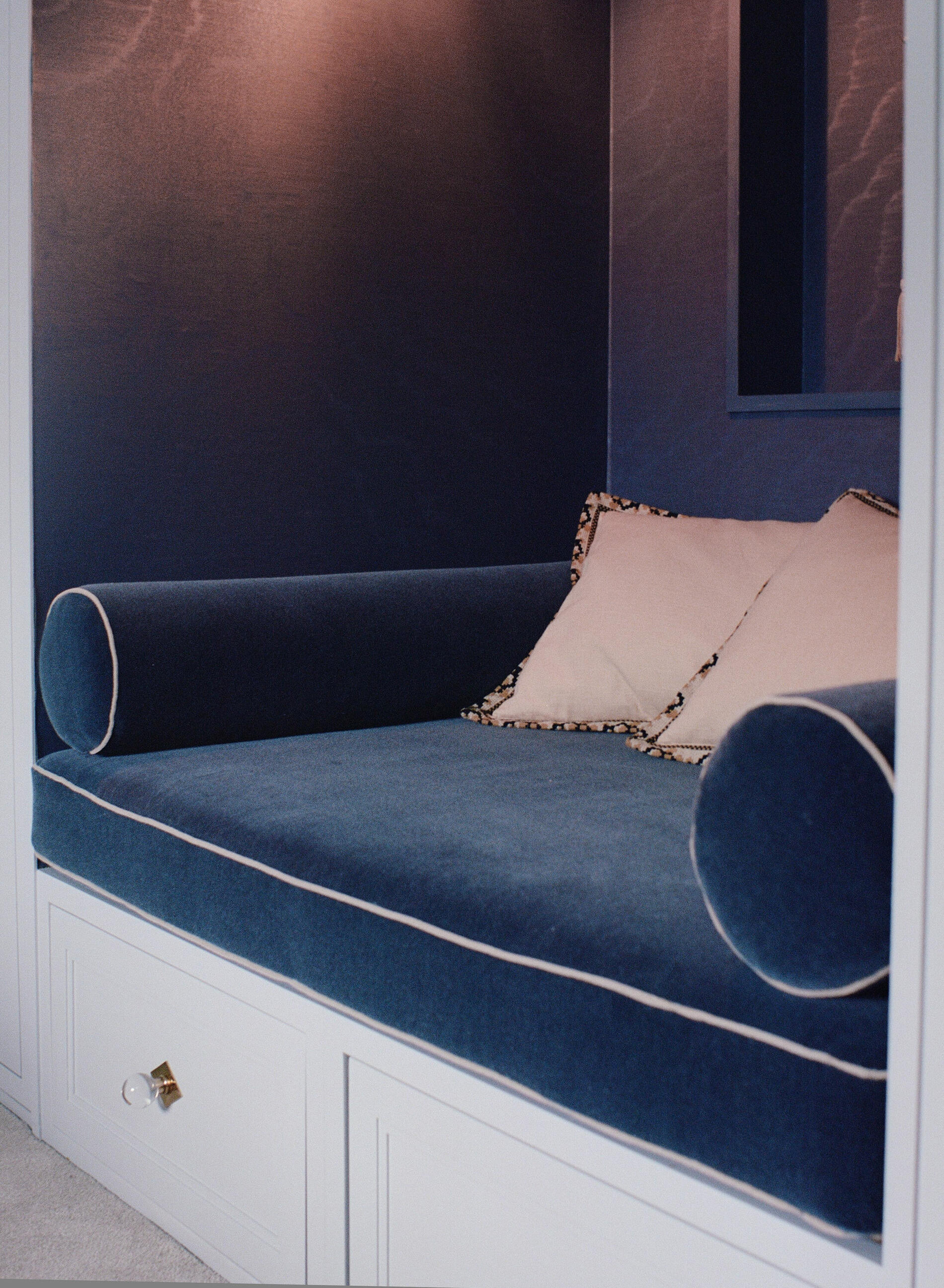 Townhouse — blue upholstered window seat with piped bolster
